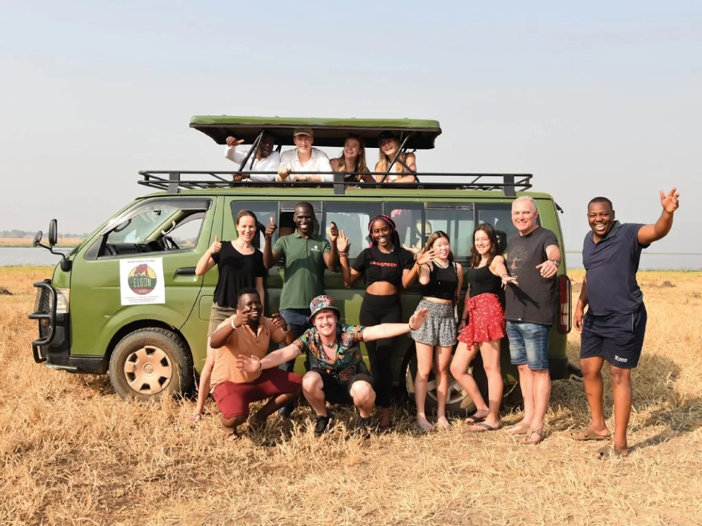 a group of tourists posing next to the Elgon Safaris vehicle in Murchison Falls National Park 1024x768 1
